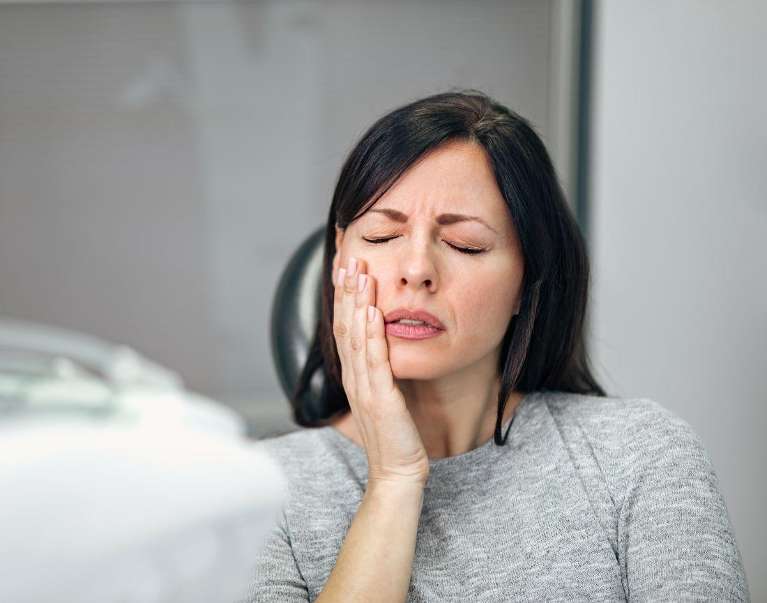 woman having tooth pain