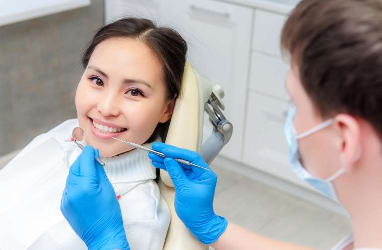 woman getting dental extraction