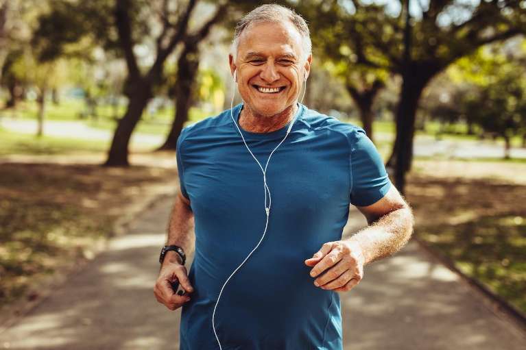 man jogging with headphones on