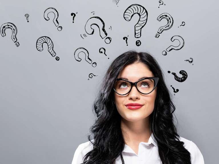 woman with questions on her head