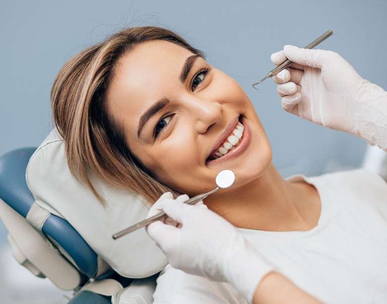 woman getting dental cleaning